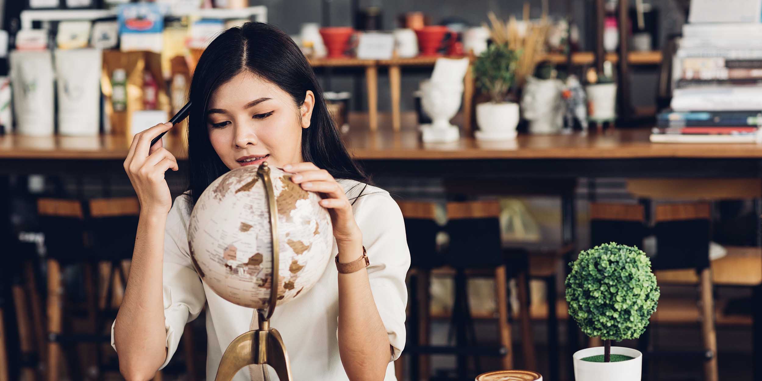 woman looking at the globe