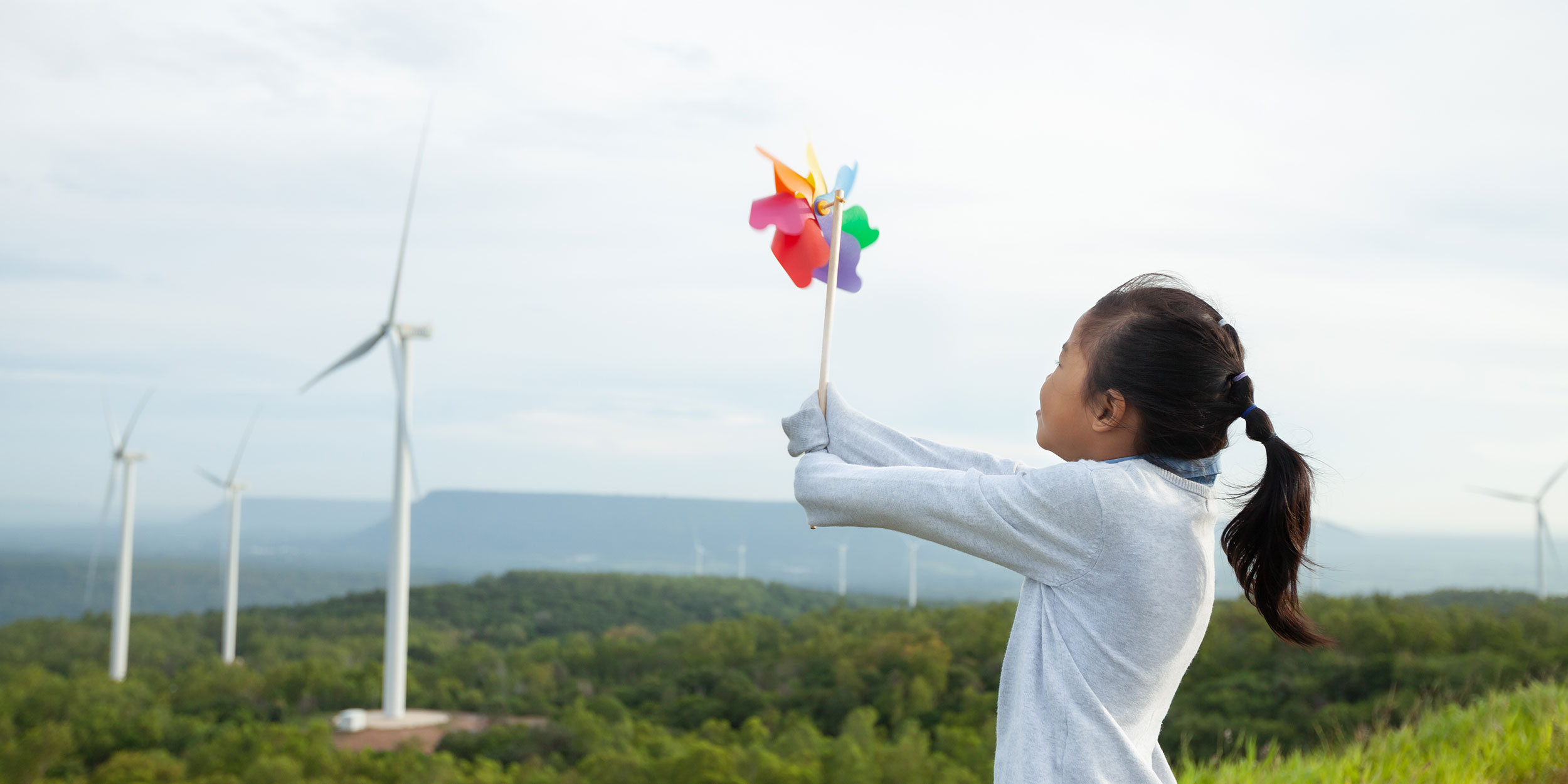 girl holding a windmill