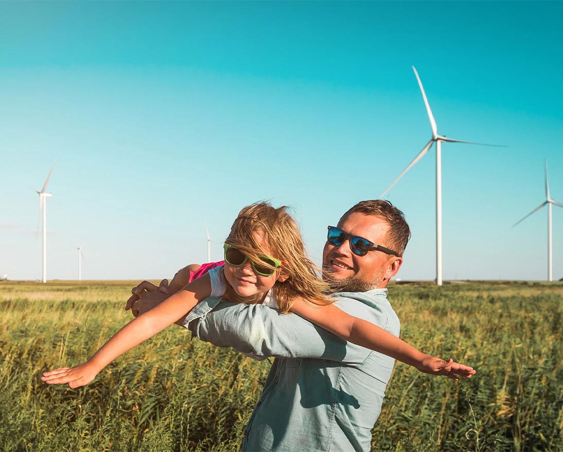 Father lifting daughter in air like plane