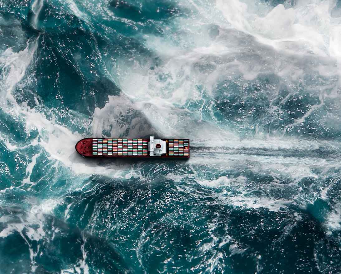 cargo ship on wavy sea