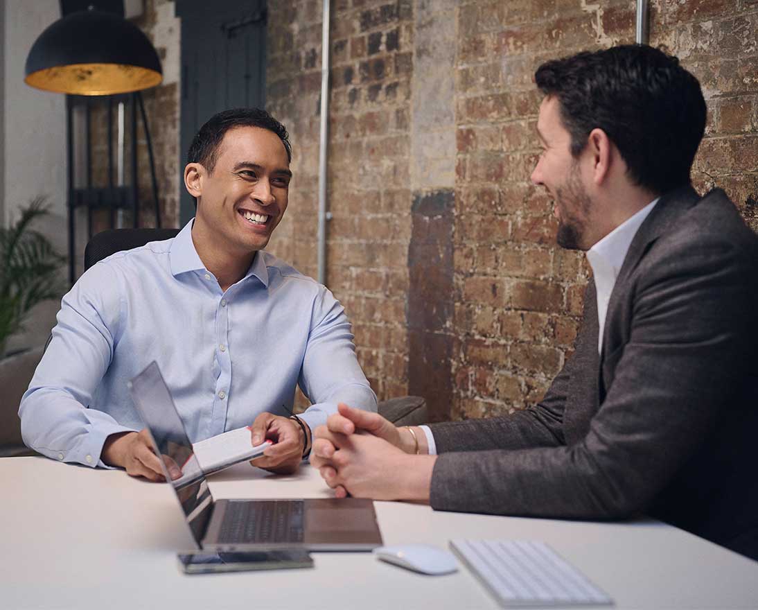 two men in a meeting