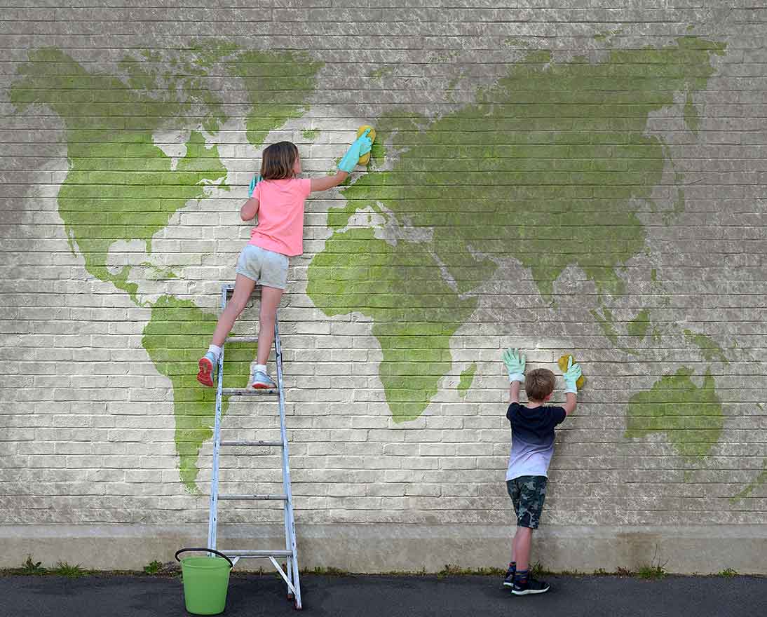kids cleaning wall with world map