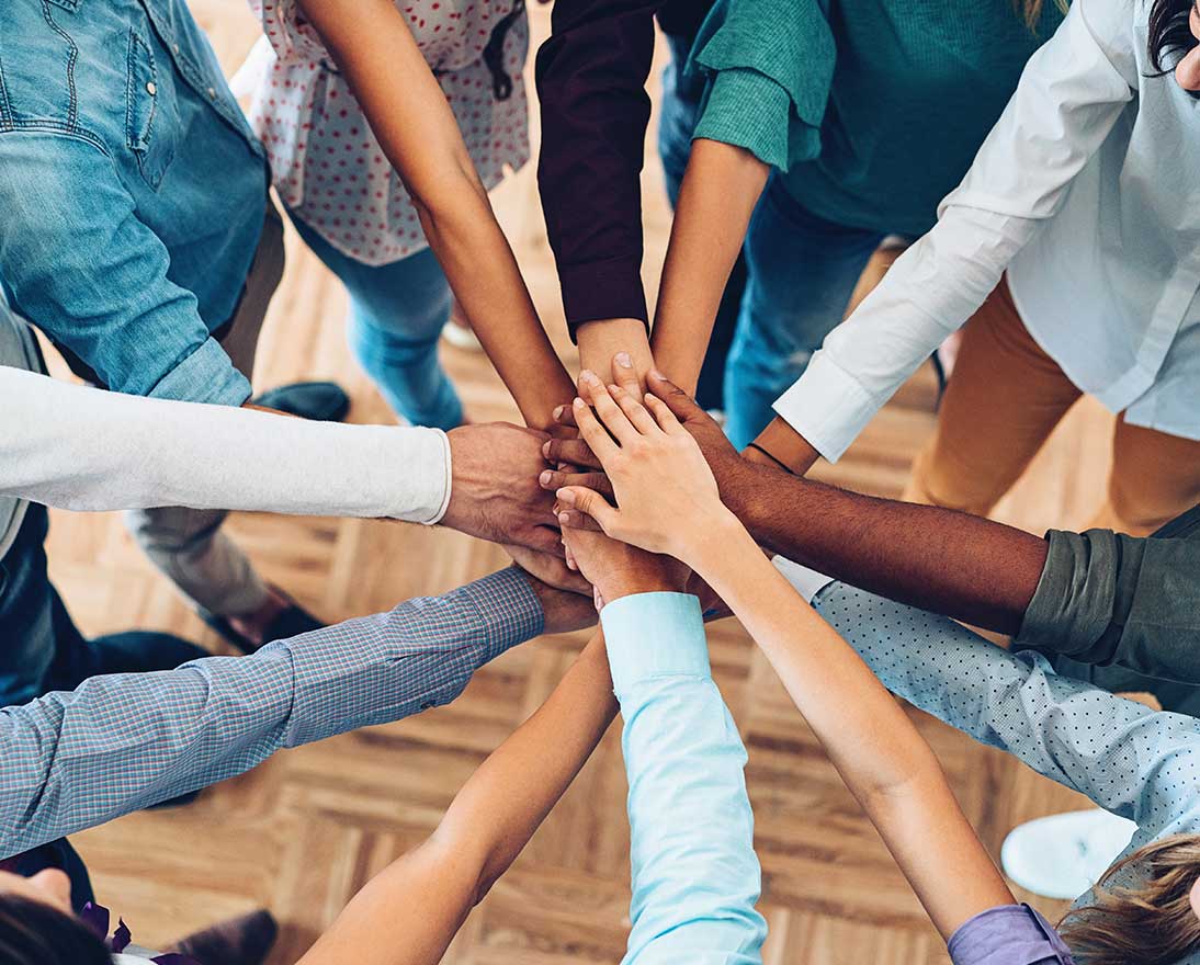 hands together in a huddle