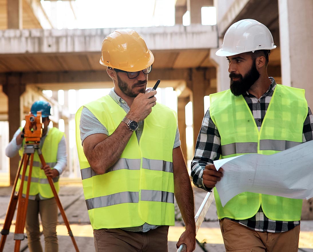 Architect consult engineer on construction site