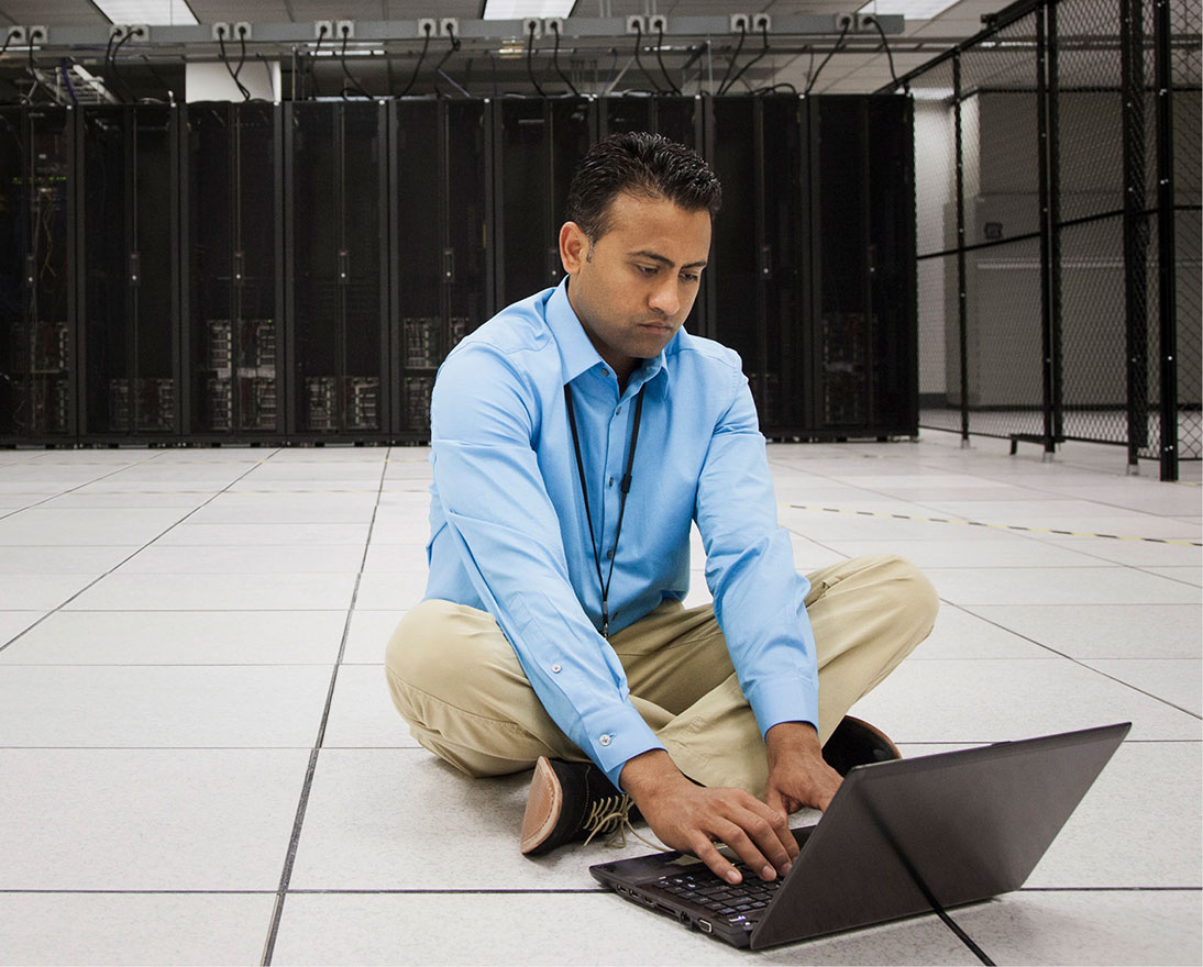man sitting on the floor with laptop