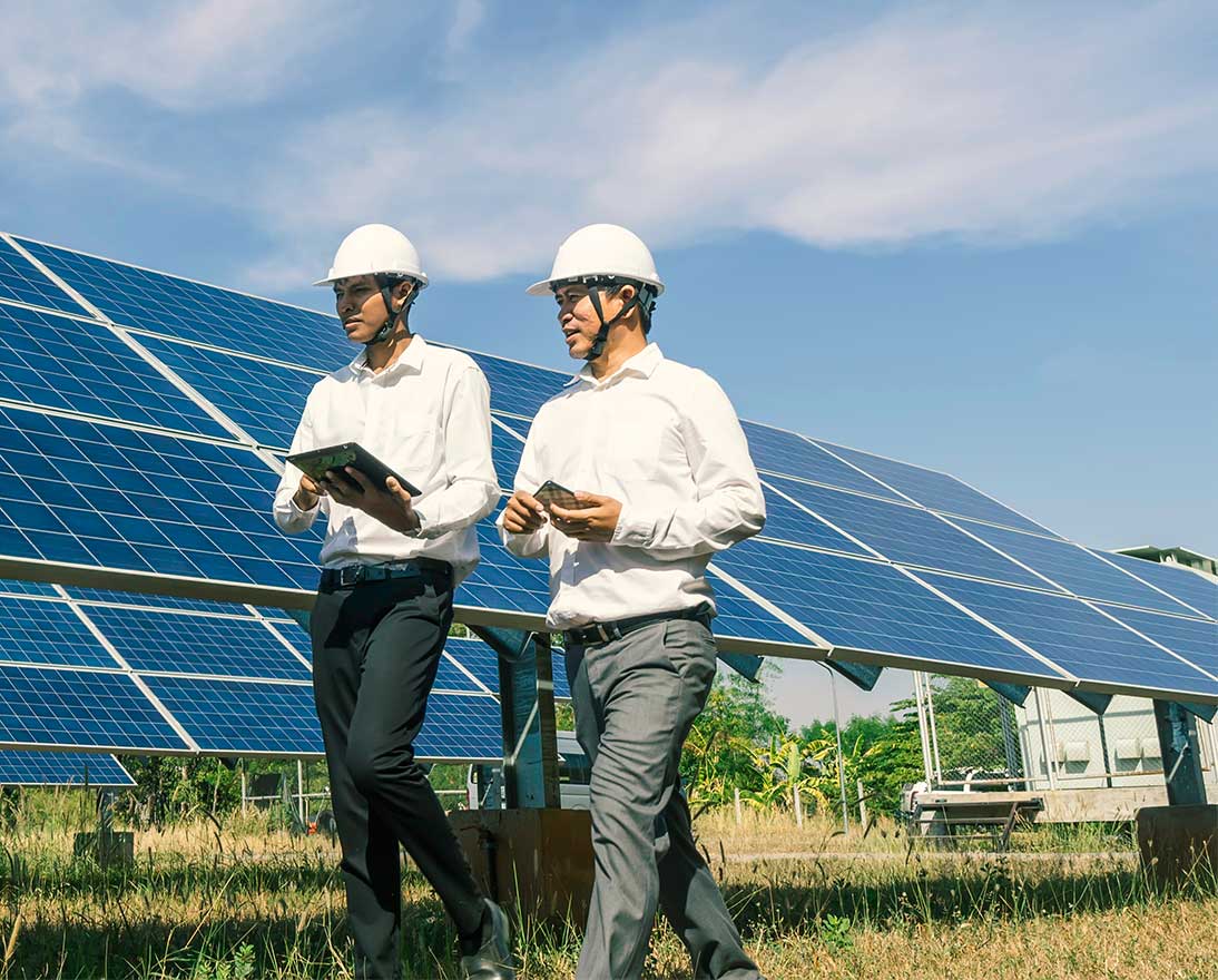 solar farm with two engineers