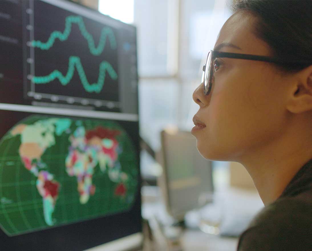 woman looking at different graphs
