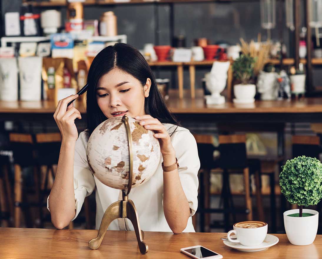 woman looking at the globe