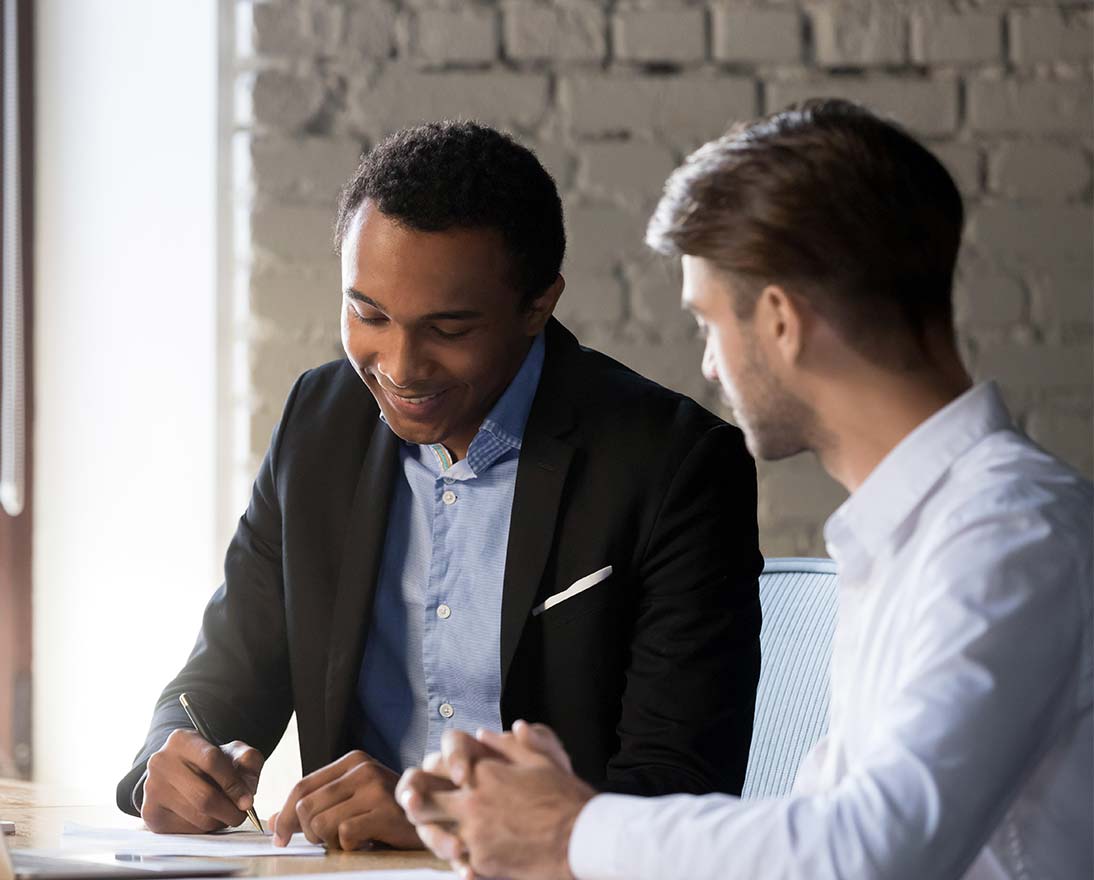 business partners signing contract
