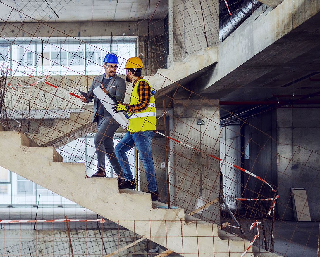 construction worker and architect are talking