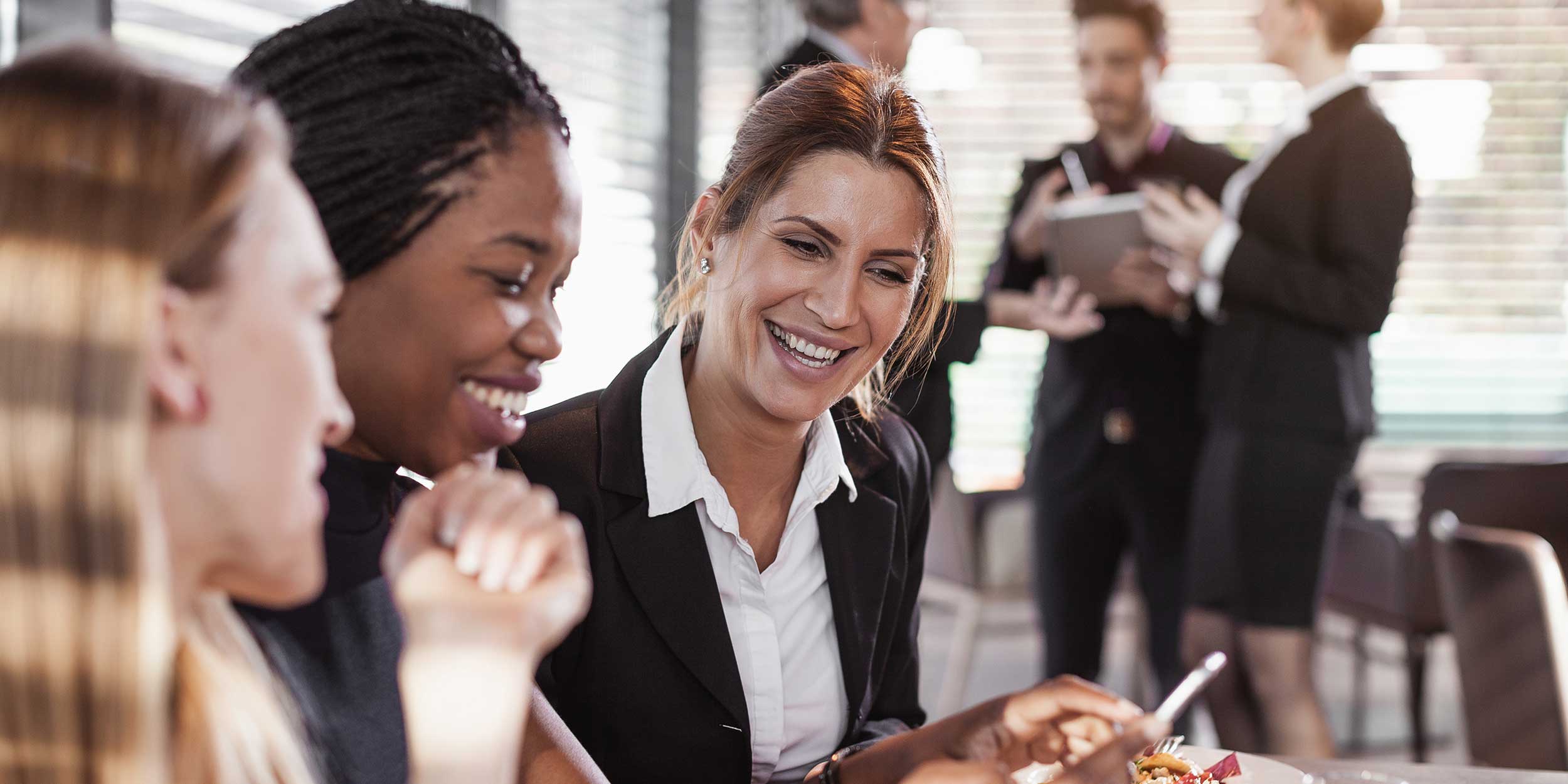 group of women laughing about something
