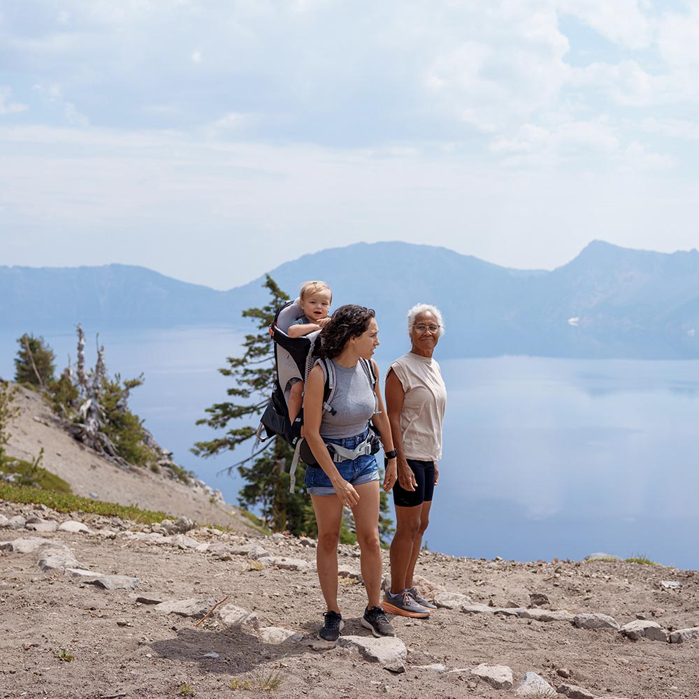 two woman on a hike at a lake