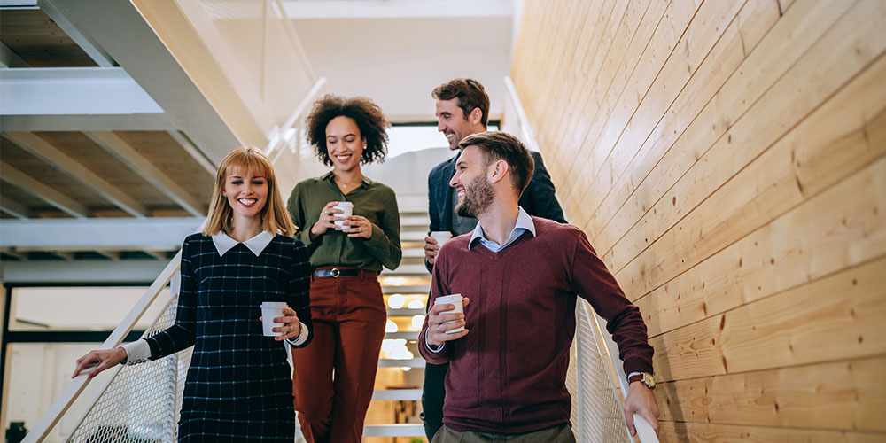 colleagues walking down the stairs together