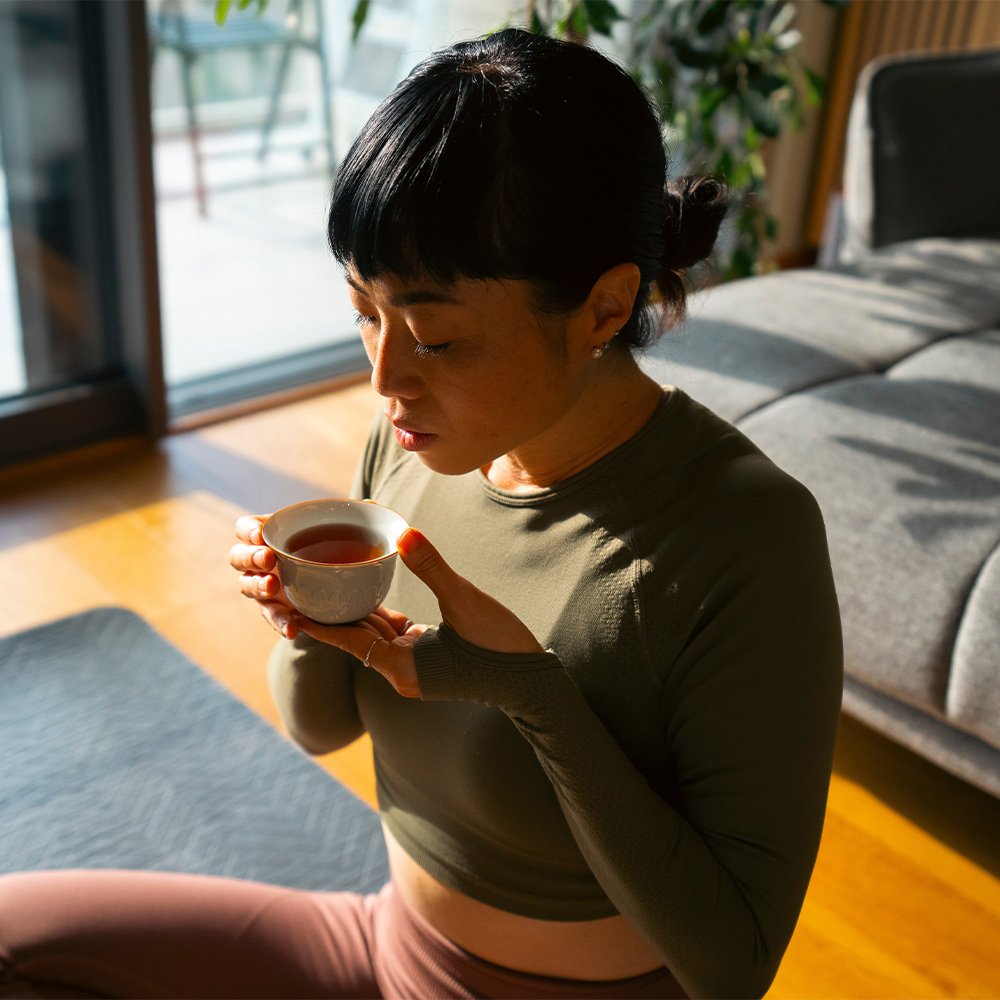 Woman drinking tea peacefully