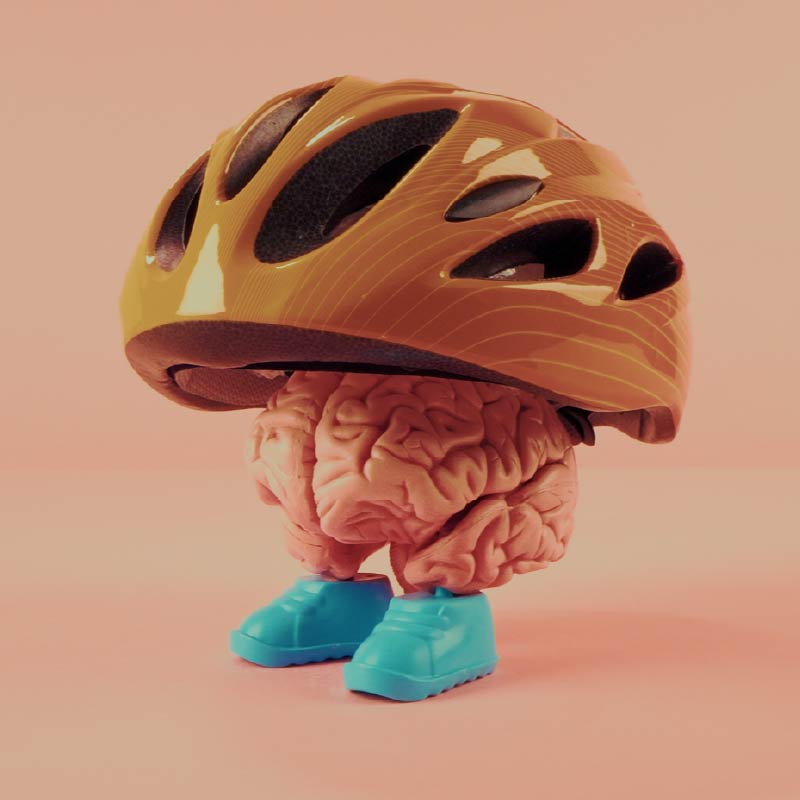 Hand holding a magnifying glass looking at 100 dollar bill