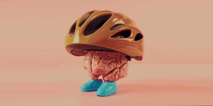 Hand holding a magnifying glass looking at 100 dollar bill