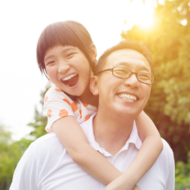 father and daughter smiling