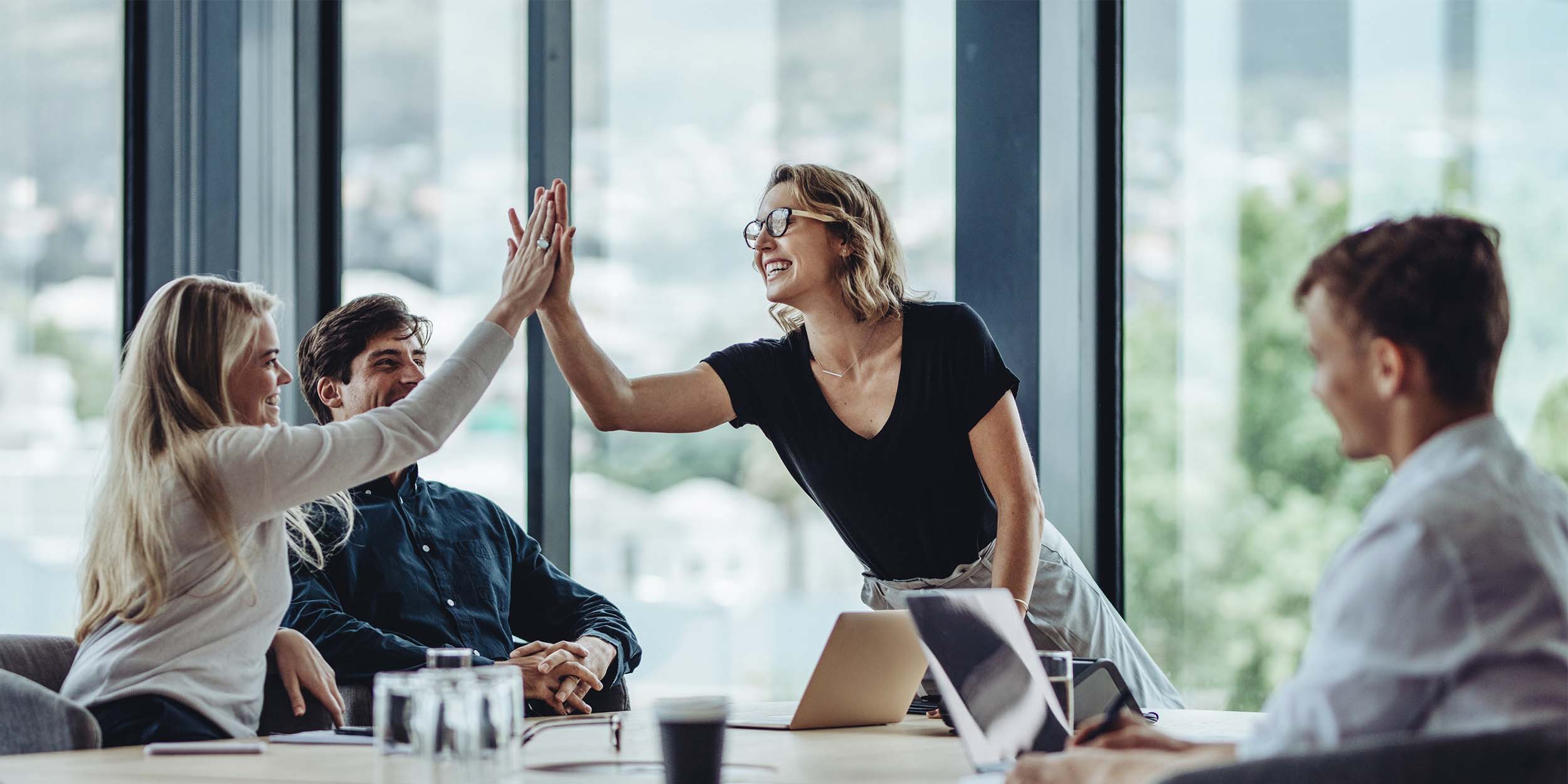 Colleagues collaborating during a meeting in a modern office