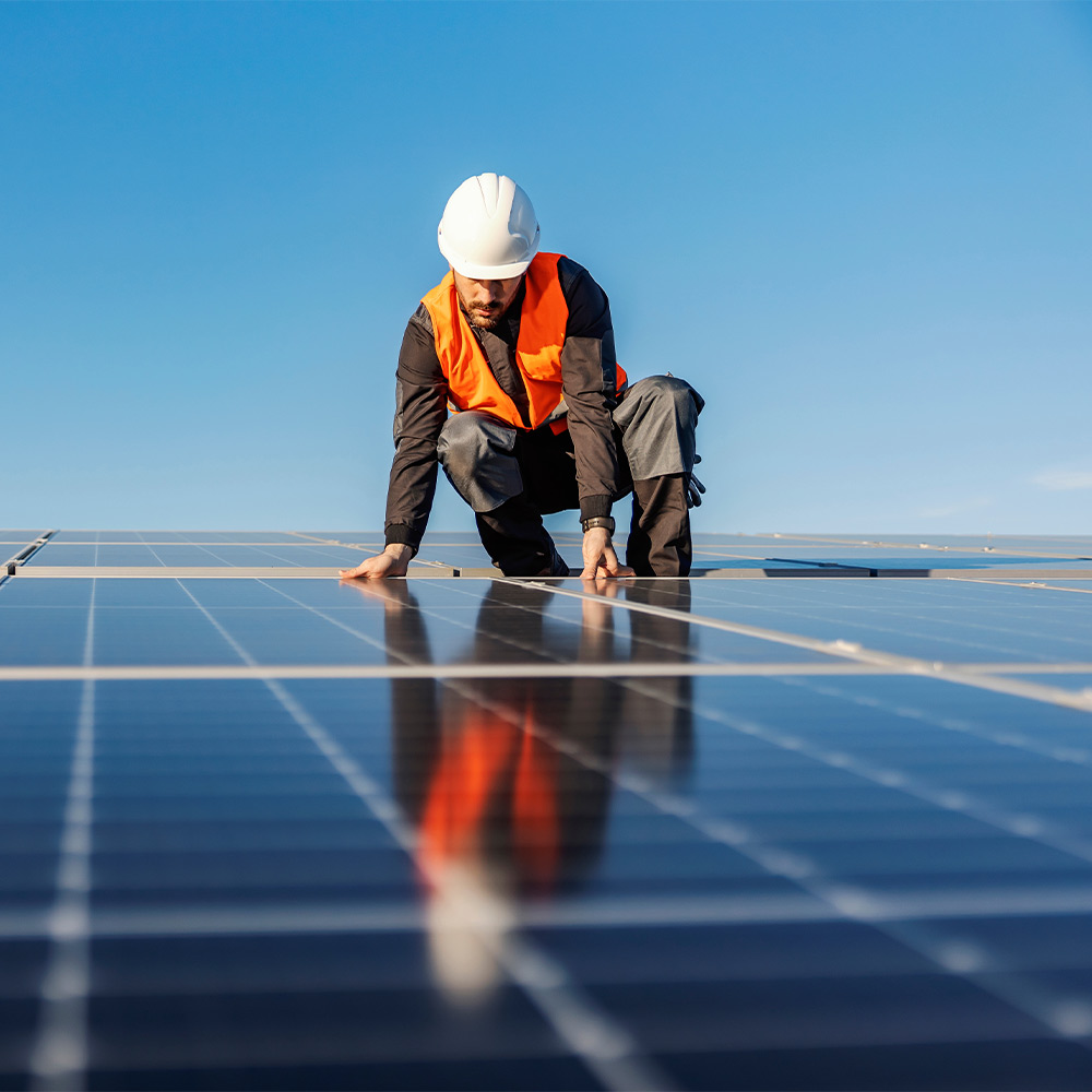 man installing solar panels