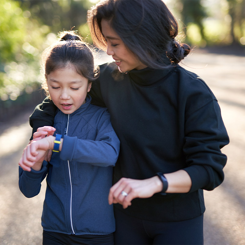 mother and daughter walking together