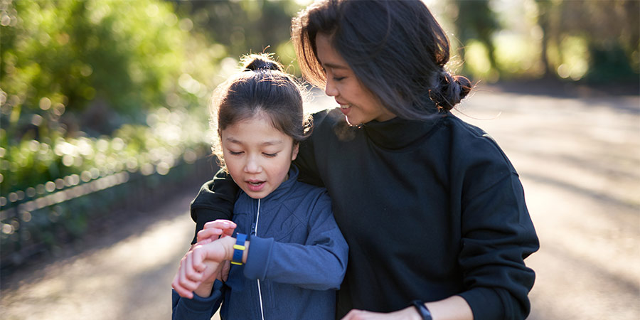 mother and daughter walking together