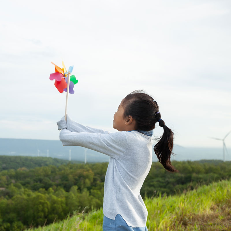 girl holding a windmill