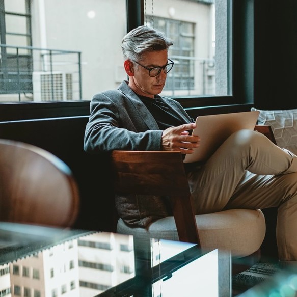 Man sitting and reading paper