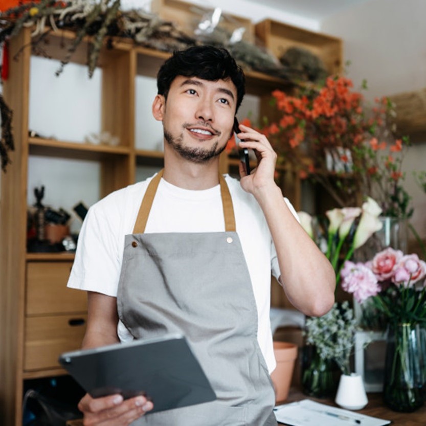 Man making a phone call with a tablet