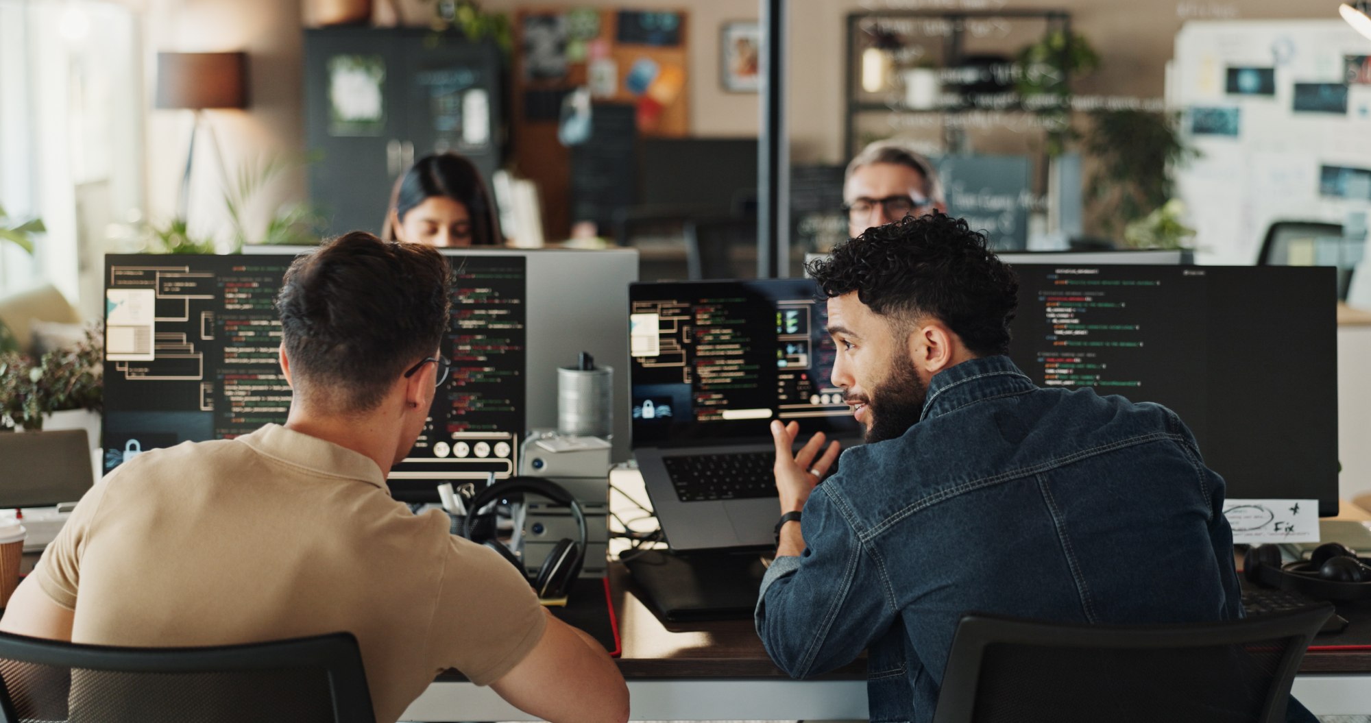 developers collaborating on code at computers