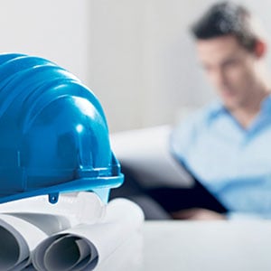 guy at desk with hardhat