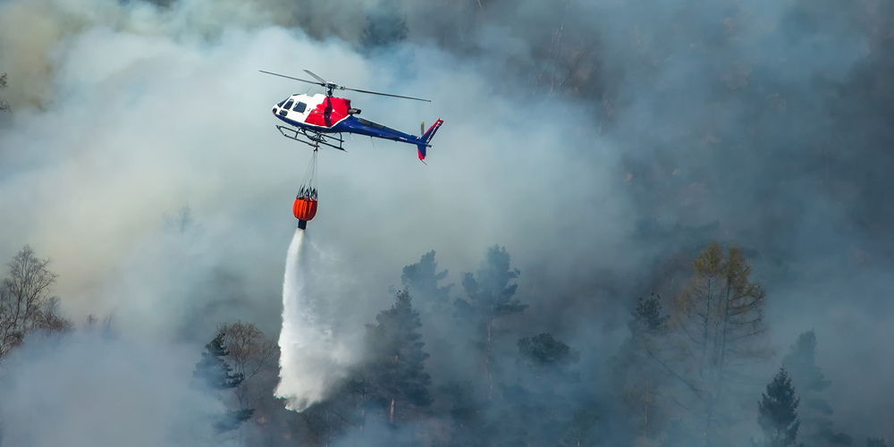 helecopter-dumping-water-on-fire
