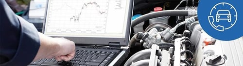 technician looking at vehicle