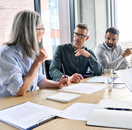 3 people in a meeting