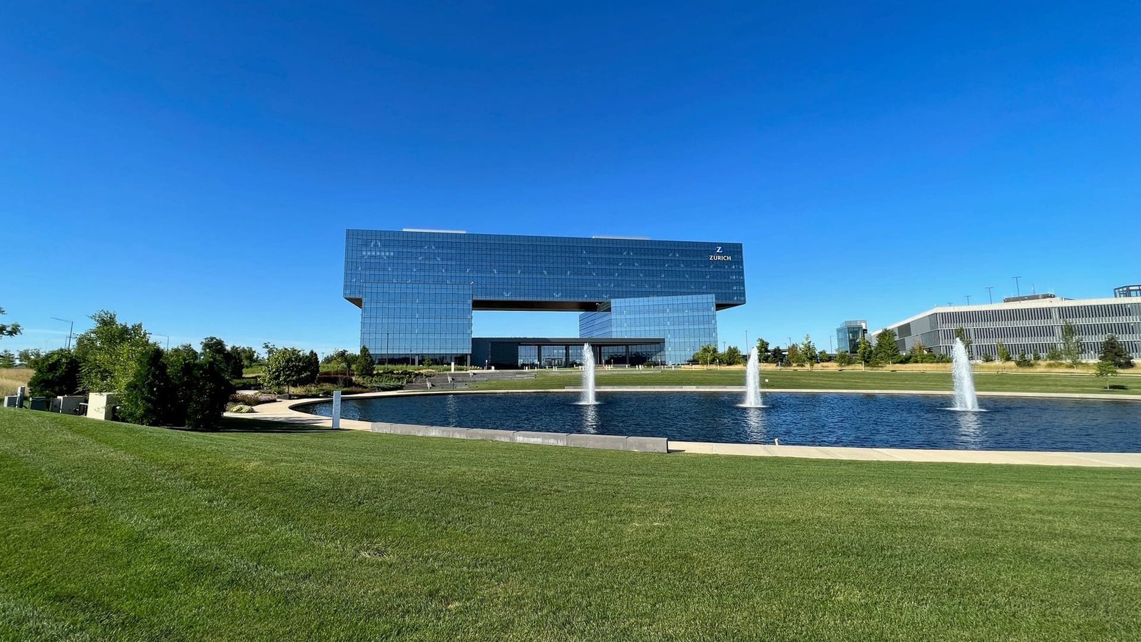 modern office building with reflecting pond