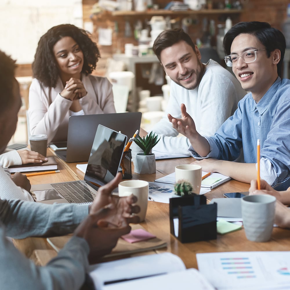 group of people talking in a meeting