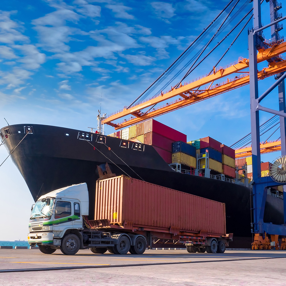 large container ship with a semi-truck 