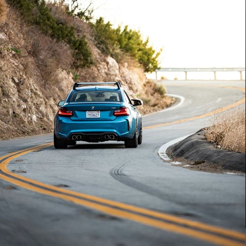 car driving around curve