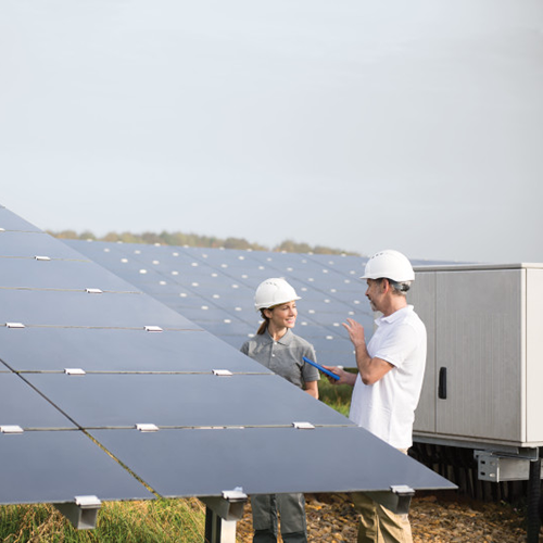 2-people-with-solar-panels