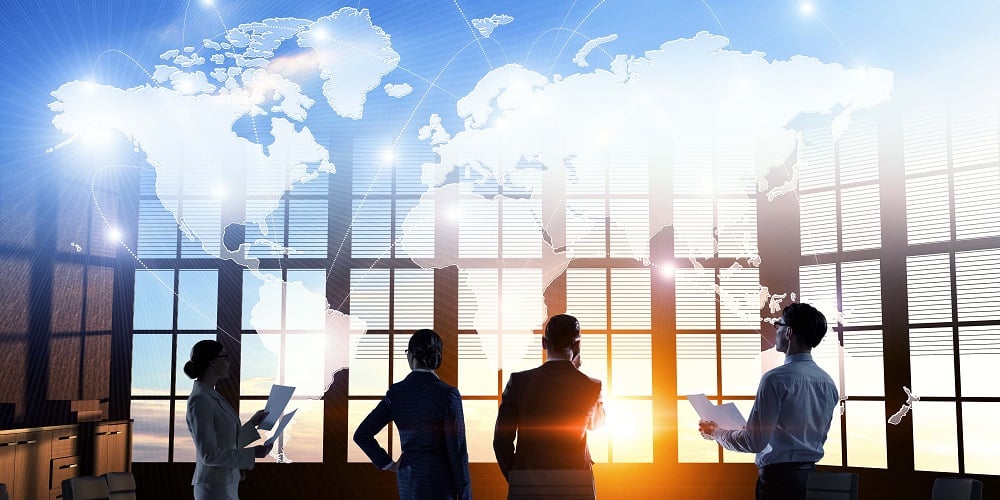 business-people-in-front-of-sunset-with-map_1000x500