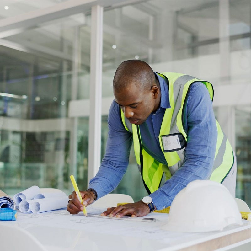 engineer reviewing blueprints