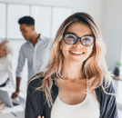 group-in-office-talking-woman-facing-camera_1000x500