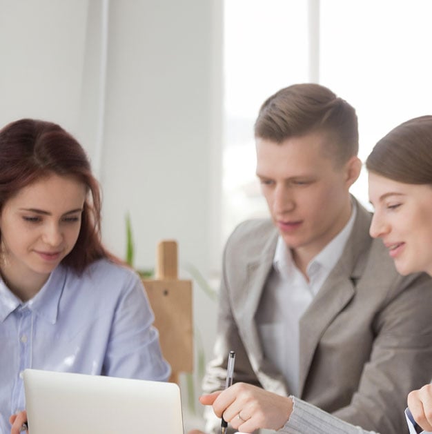 group working around a computer