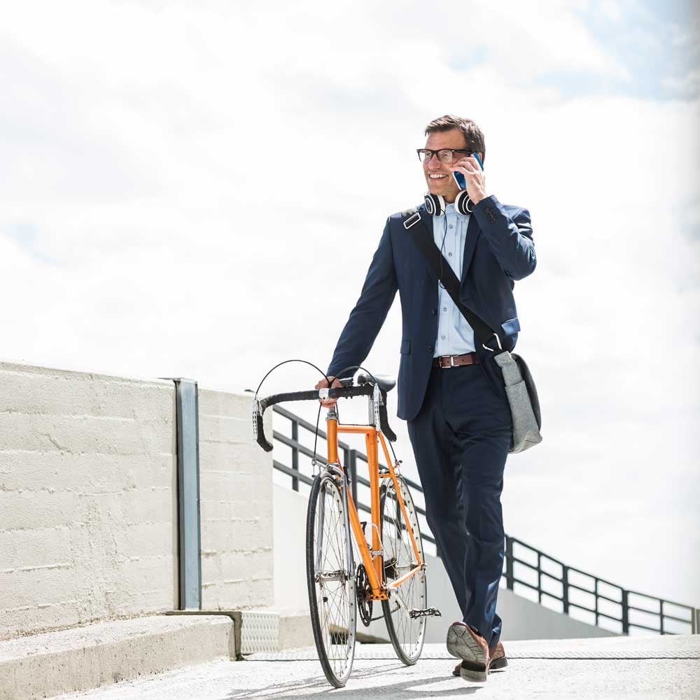 man with bike on phone