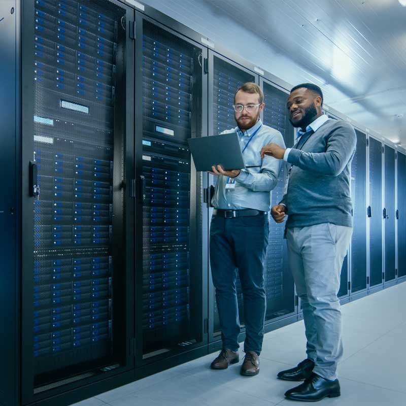two-men-talking-in-front-of-servers