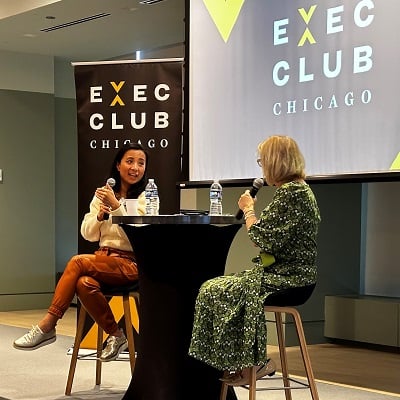 two women talking in a stage