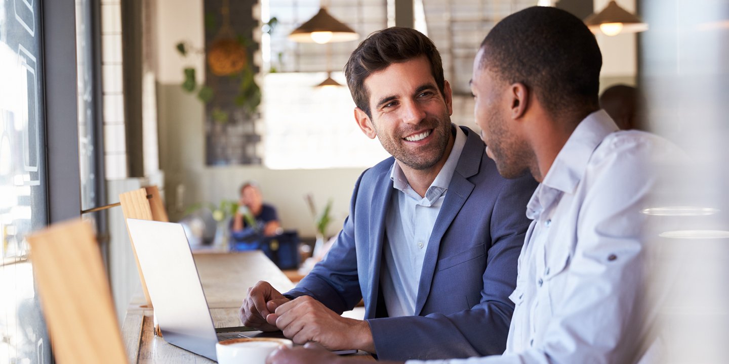 Two professionals seated at a table