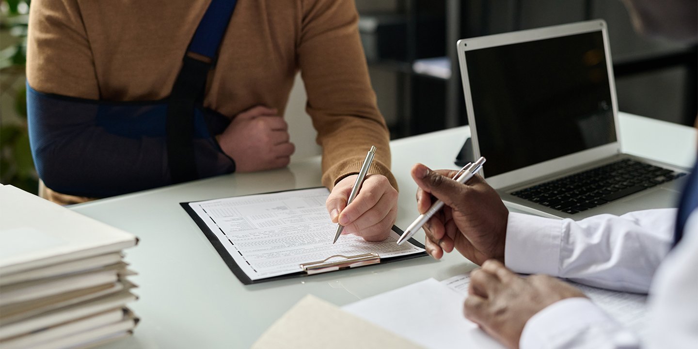 Injured workers filling out forms.jpg