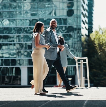 Two people walking and talking