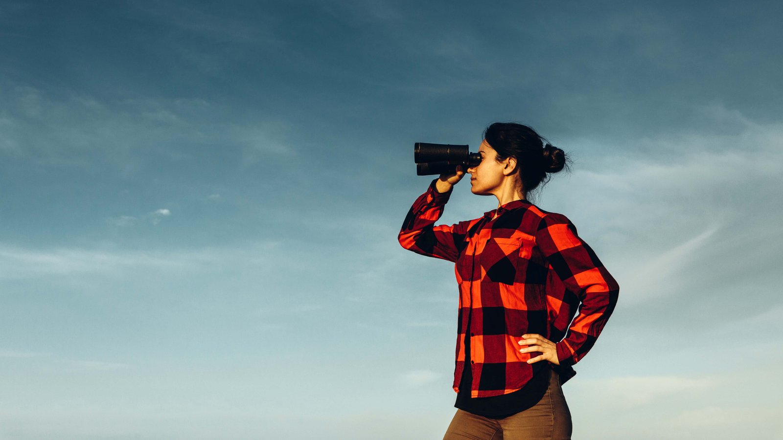 girl looking through binoculars