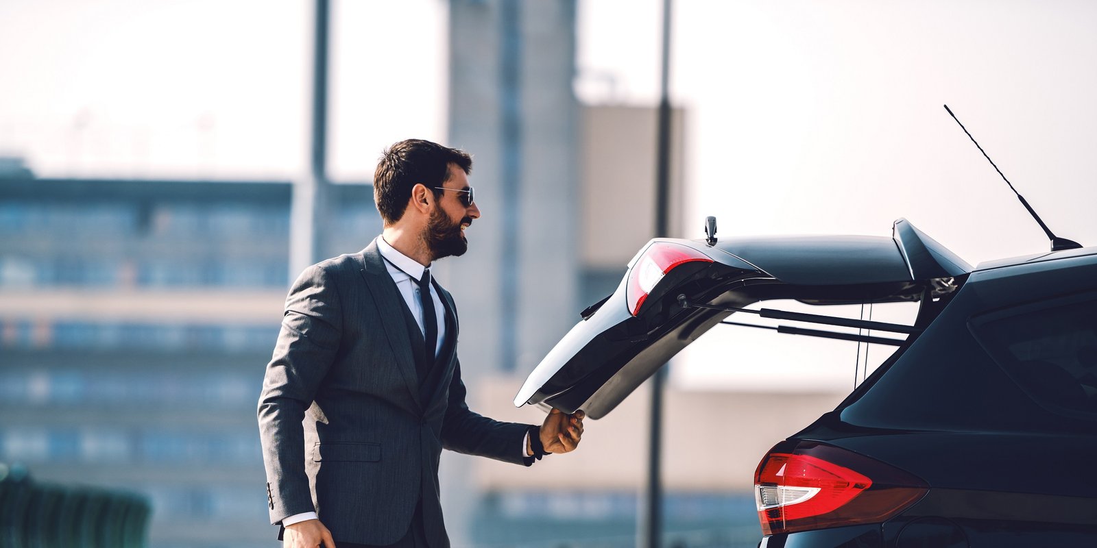 Man opening the car trunk